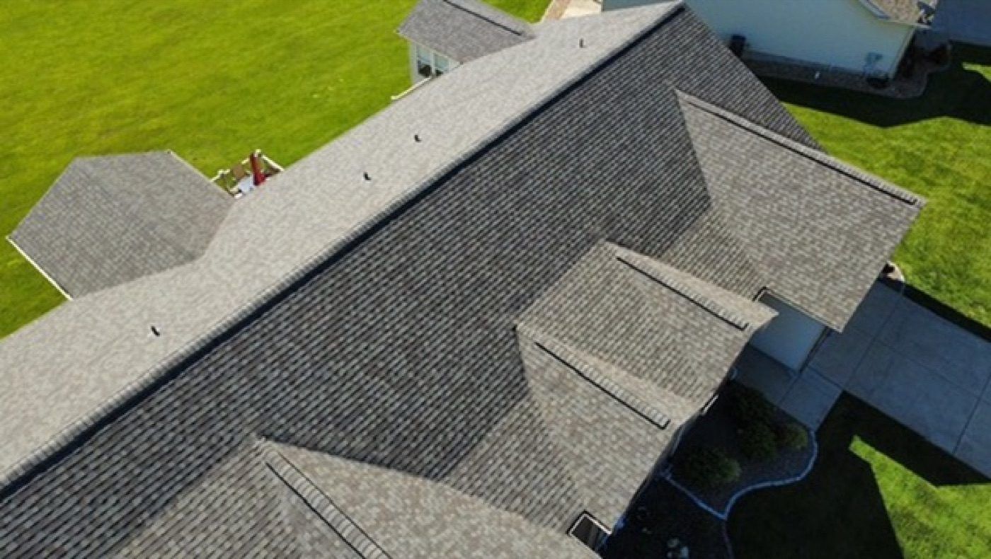Completed new shingle roof by Emmendorfer Exteriors in Union, MO, drone view