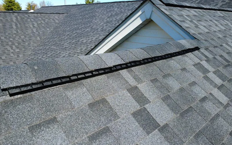 Low-pitch shingle plane and ridge vent on a Franklin County roof